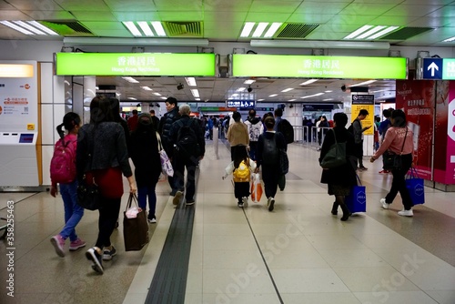 Lo Wu, North District, New Territories, Hong Kong - 28 December 2019: People crossing the Land boundary control point at Lo Wu Station from Hong Kong to mainland China.
