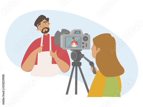 Cooking Blog flat vector illustration. Concept of live streaming, broadcast, social media networking, food and cooking blog, online cooking training. A girl is filming a guy who cooks food.