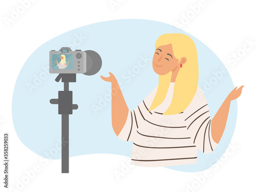 Blogger records video on the camera. Concept of live streaming, broadcast, social media networking, personal blog, making money on the Internet on creativity. Girl takes video of herself on camera © Hanna