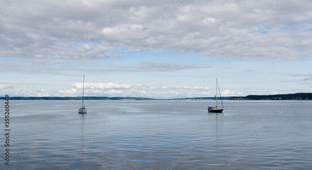 Two sailboats near city pier in Port Townsend Two sailboats near city pier in Port Townsend