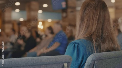 Back of woman listening to a presentation