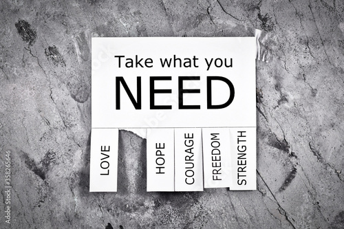 Fotografi White tear-off stub note with text 'Take what you need' and words 'Love, Freedom
