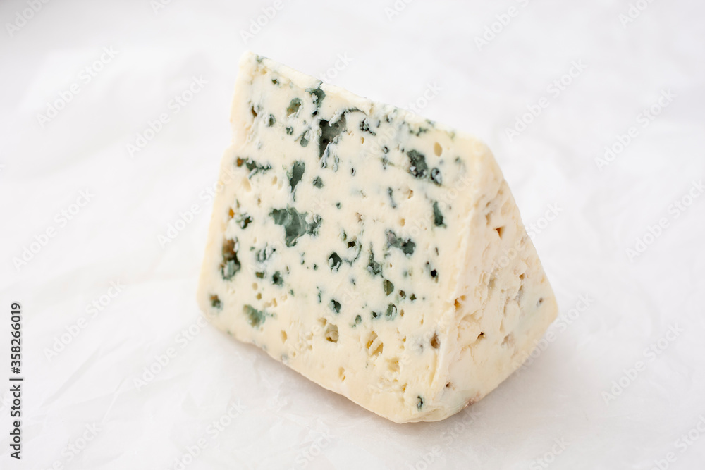 cheese containing veins of blue mold, such as Gorgonzola and Danish Blue.