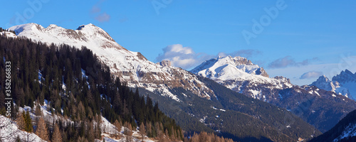 Panoramic landscape of the winter mountain at sunset time in the Dolomites Alps in Italy.