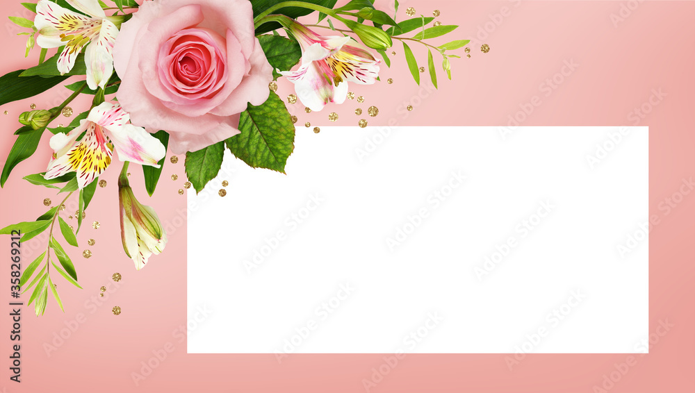 Pink roses and alstroemeria flowers with glitter golden confetti in a corner arrangement with a white card