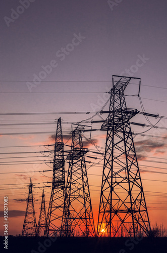  high-voltage power lines at sunset.