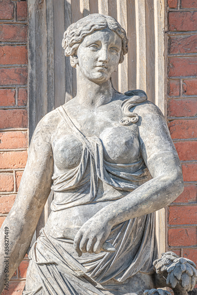 Obraz premium Old statue of a sensual Renaissance Era woman in the central city park of Potsdam, a German town of statues and sculptures, Germany