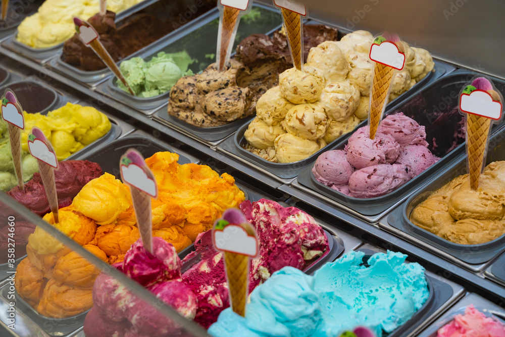 yellow green pistachio cream blue ice cream in balls in trays yellow green pistachio cream blue ice cream in balls in trays
