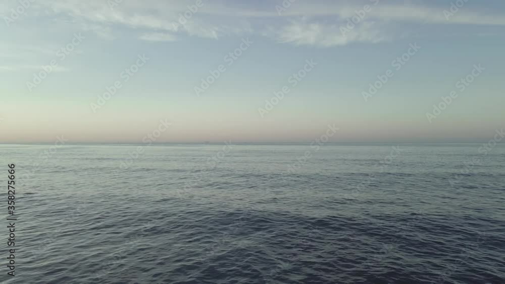 Calm static smooth blue ocean waves liquid sea water surface and empty skyline Calm static smooth blue ocean waves liquid sea water surface and empty skyline