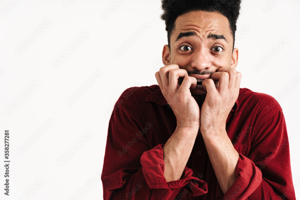 Scared african young man posing isolated Scared african young man posing isolated