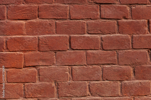 Texture painted dark brown brick wall