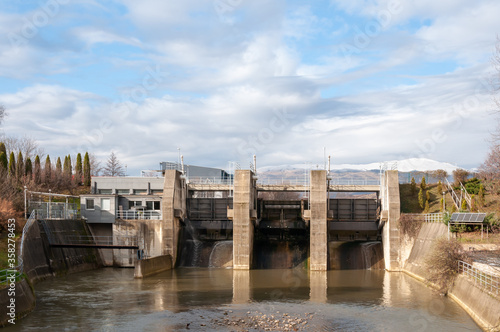 Small hydroelectric dam on a small river. Renewable power sources are extremely important. Building small hydroelectric dams is a lucrative business, and progress driver.