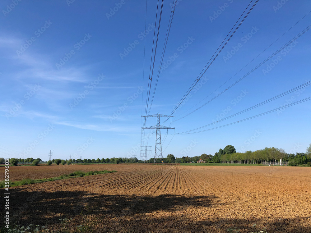 High power electricity poles in farmland around Hummelo