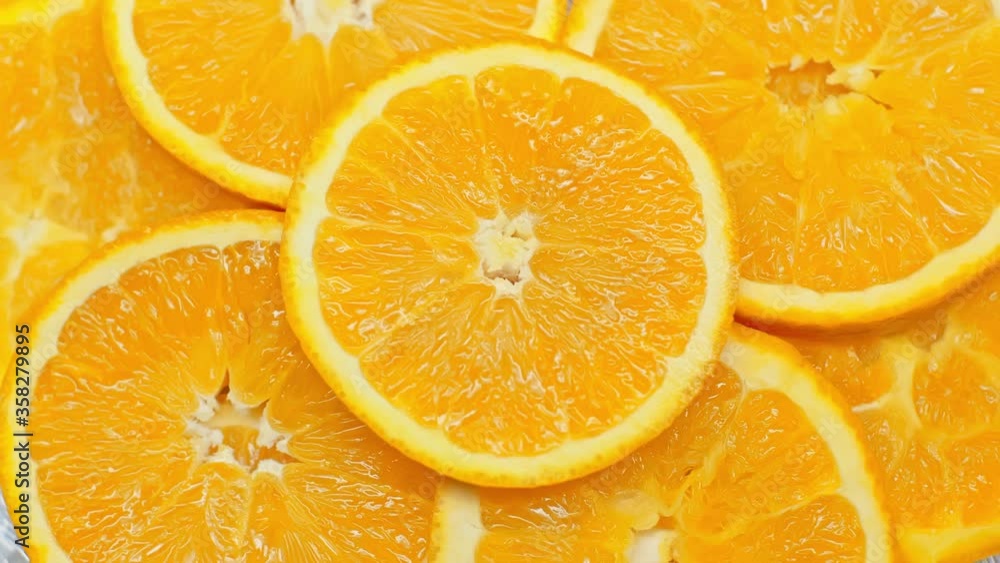 Top view of spinning slices of fresh orange Top view of spinning slices of fresh orange
