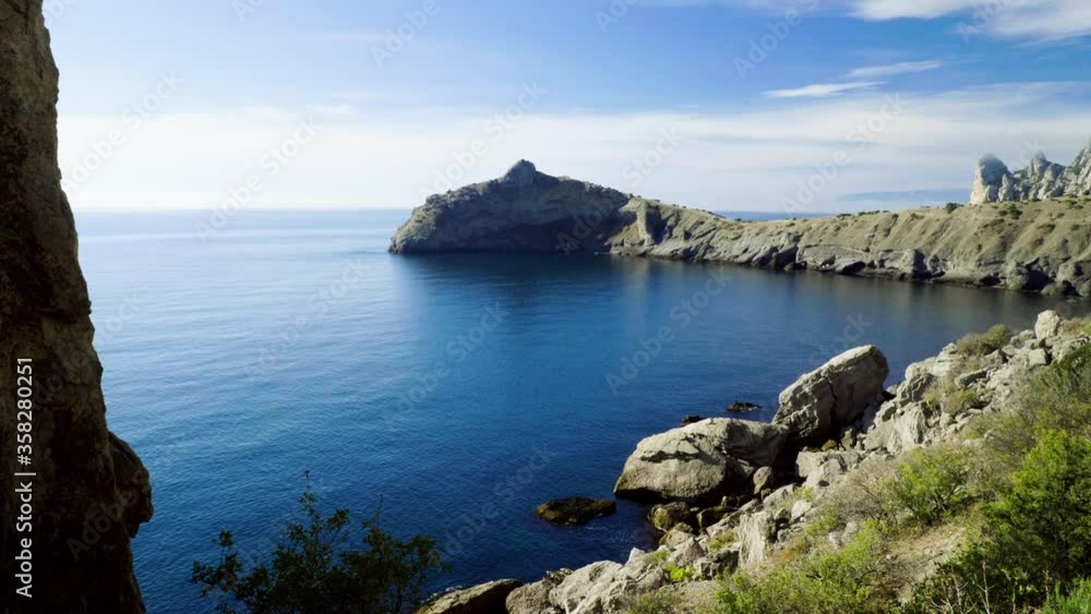 Stunning landscape of calm sea. Beautiful bay surrounded by mountains and a rocky seashore. 4K Stunning landscape of calm sea. Beautiful bay surrounded by mountains and a rocky seashore. 4K