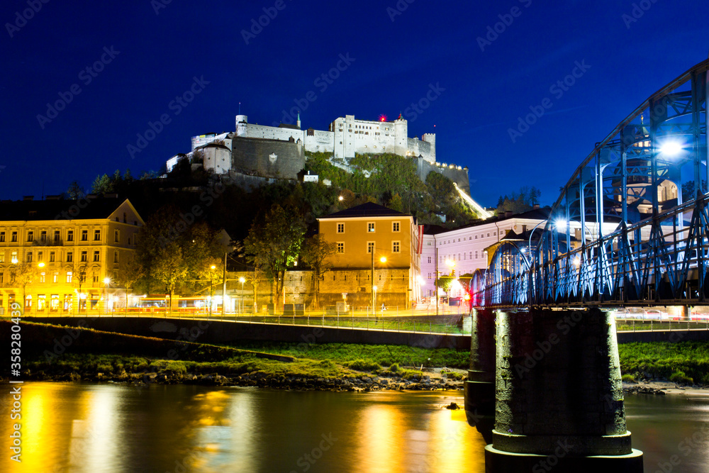 Fototapeta premium Beautiful view of Salzburg skyline with Festung Hohensalzburg and Salzach river at twilight, Salzburg, Salzburger Land, Austria.