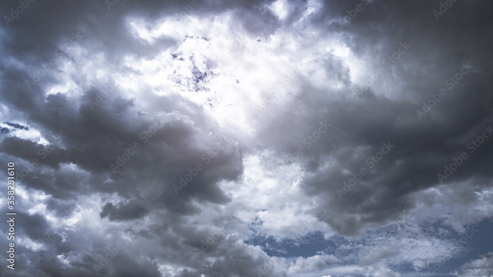 Picturesque clouds in the sky. Window view of an airplane on a sunny gloomy day. Stock photo background
