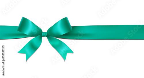 Shiny turquoise ribbon bow isolated on white background with copy space. For using special days. 