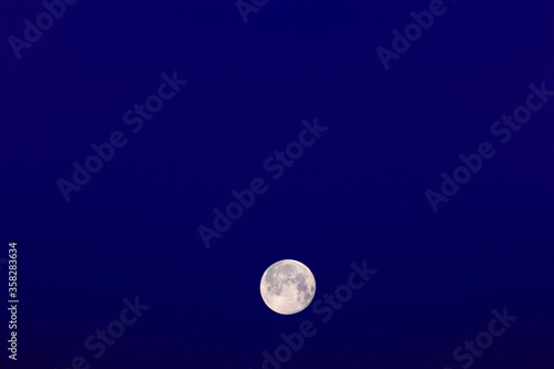 Bright full moon in the sky in winter