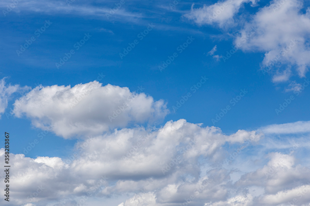 beautiful clouds on a blue sky. Natural background and texture beautiful clouds on a blue sky. Natural background and texture