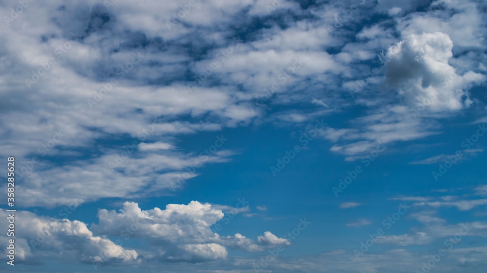 white clouds floating in the blue sky white clouds floating in the blue sky