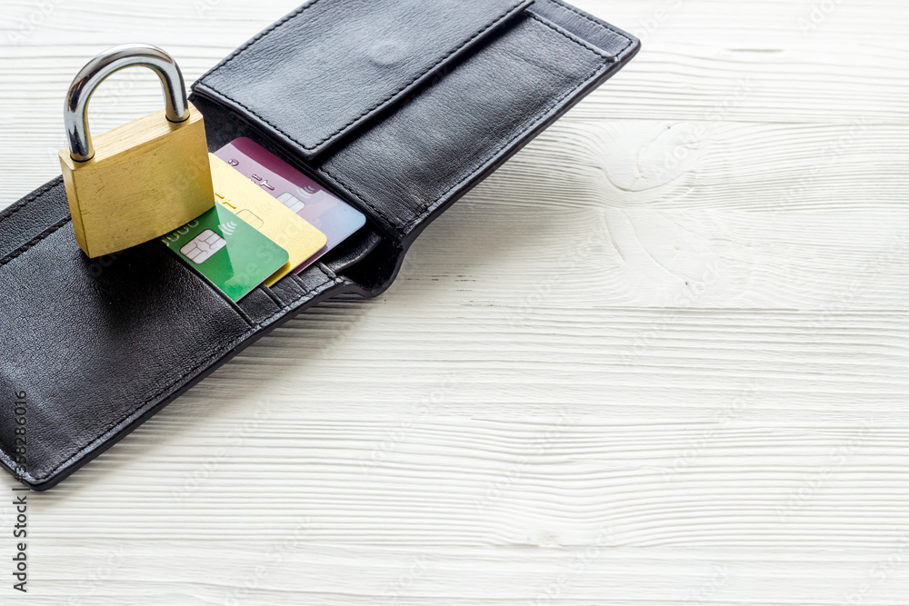 Credit card security concept with lock, wallet on white desk copy space Credit card security concept with lock, wallet on white desk copy space