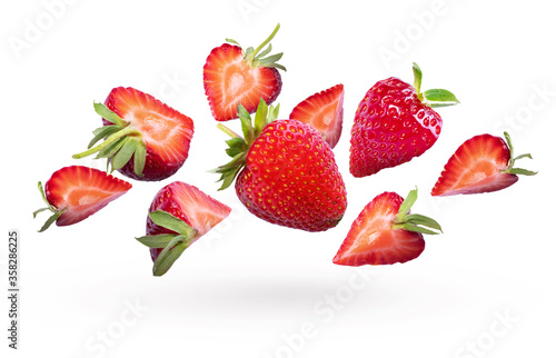 Strawberries and sliced ​​strawberries isolated on a white background. Fresh strawberries