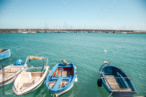 view to marina with sailboats from marina with fisher boats © Maria