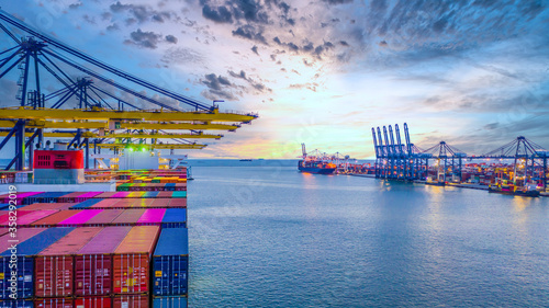 Container ship unloading in deep sea port, Global business logistic import export freight shipping transportation oversea worldwide container ship, Container vessel loading cargo cargo freight ship.