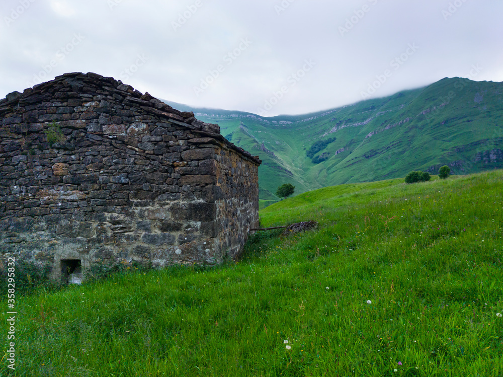 Spring landscape of pasiegas cabins and meadows in the Miera Valley in the Autonomous Community of Cantabria. Spain, Europe Spring landscape of pasiegas cabins and meadows in the Miera Valley in the Autonomous Community of Cantabria. Spain, Europe