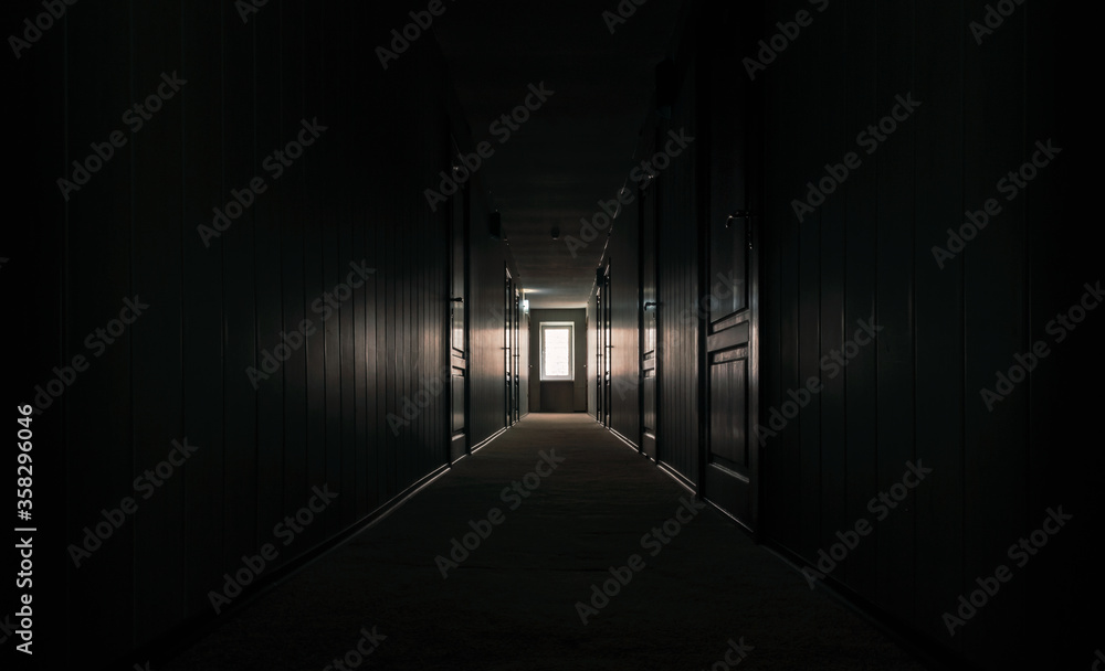 gloomy dark corridor of an empty hotel without people during quarantine gloomy dark corridor of an empty hotel without people during quarantine
