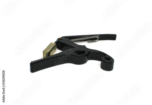 Capo is a small device used to clamp the guitar for strapping or strapping the guitar neck, ukulele, bass. 