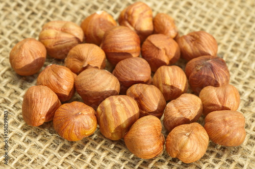 Hazelnuts on burlap close up