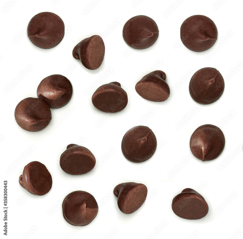 Chocolate chips morsels close up from top view isolated on white background. Chocolate chips morsels close up from top view isolated on white background.