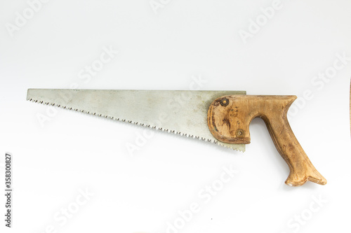 vintage hacksaw for wood on a white background
