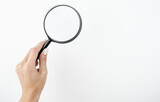 image of spying woman's hand holding magnifying glass on isolated white background