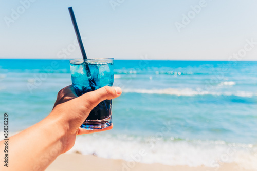 blue cocktail at the beach