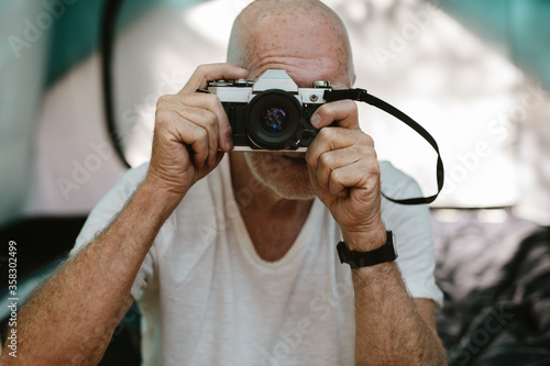 Capturing the landscape in his camera photo