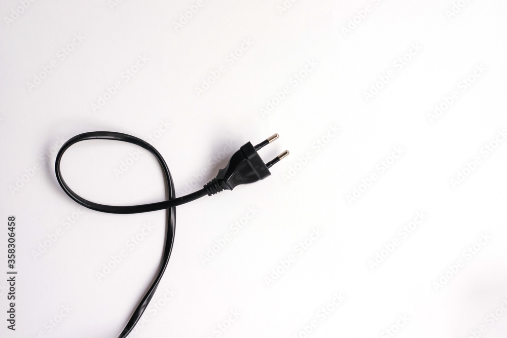 The electric plug is black on a white background.Electric current. The electric plug is black on a white background.Electric current.