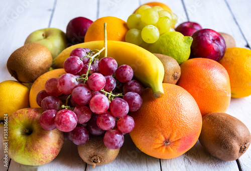 Fototapeta Naklejka Na Ścianę i Meble -  Fresh fruit, orange, banana, grapes and other fruits