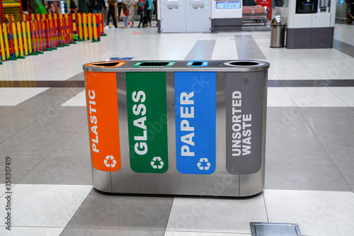 Modern trash bins for waste segregation.  Separate waste collection. Management recycle garbage. photo