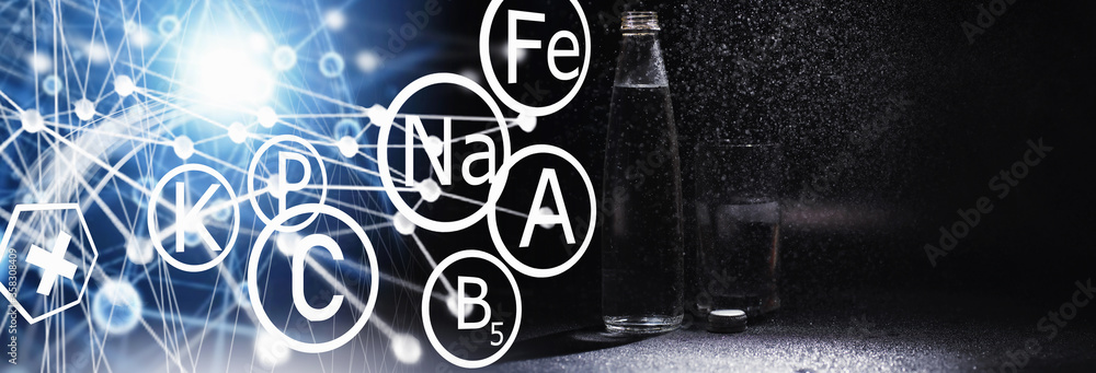 Obraz premium Close up pouring purified fresh drink water from the bottle on table in living room. Drinking water. Mineral vitamin water. Healthy, mineral-rich, refreshing water.