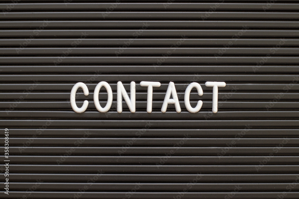 Black color felt letter board with white alphabet in word contact background Black color felt letter board with white alphabet in word contact background