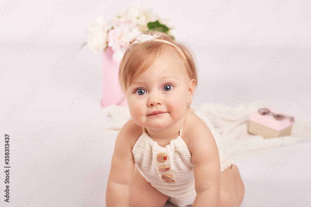 Sweet funny baby in hat with flowers. Easter greeting card, copyspace for your text. Poster for Easter holiday. Congratulations on Mother's Day. Cute baby girl. Children Protection Day. Sweet funny baby in hat with flowers. Easter greeting card, copyspace for your text. Poster for Easter holiday. Congratulations on Mother's Day. Cute baby girl. Children Protection Day.