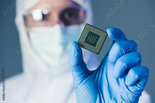 Scientist holding a chipset  photo