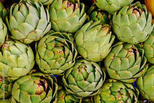 Group of artichokes. Healthy fresh artichokes are grown on an organic farm. Royalty high-quality free stock image of vegetables. Food background