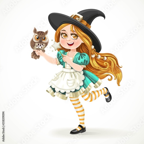 Cute little girl dressed as witch with a owl and magic wand stan