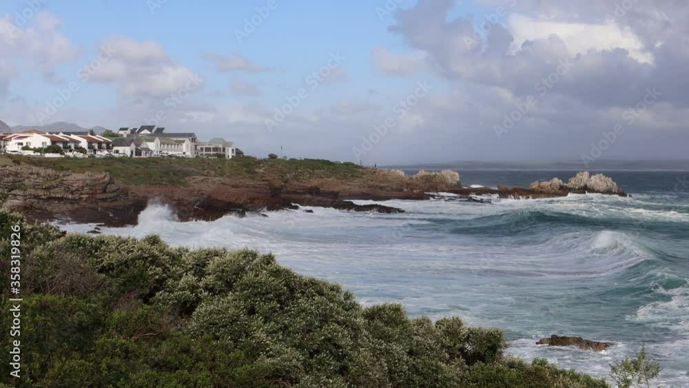 A panorama of the ocean in Hermanus, South africa a town known for whale watching A panorama of the ocean in Hermanus, South africa a town known for whale watching