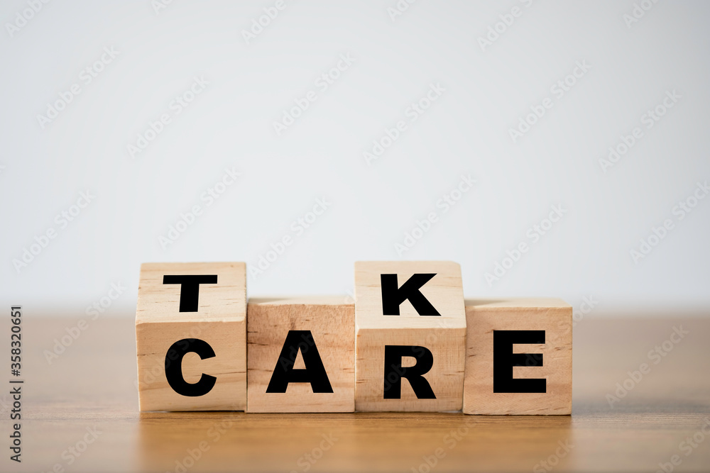 Flipping of take care yourself wording which print screen on wooden cubes blocks on table. Flipping of take care yourself wording which print screen on wooden cubes blocks on table.