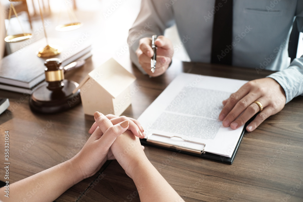 Legal counsel presents to the client a signed contract with gavel and legal law. justice and lawyer concept. Legal counsel presents to the client a signed contract with gavel and legal law. justice and lawyer concept.